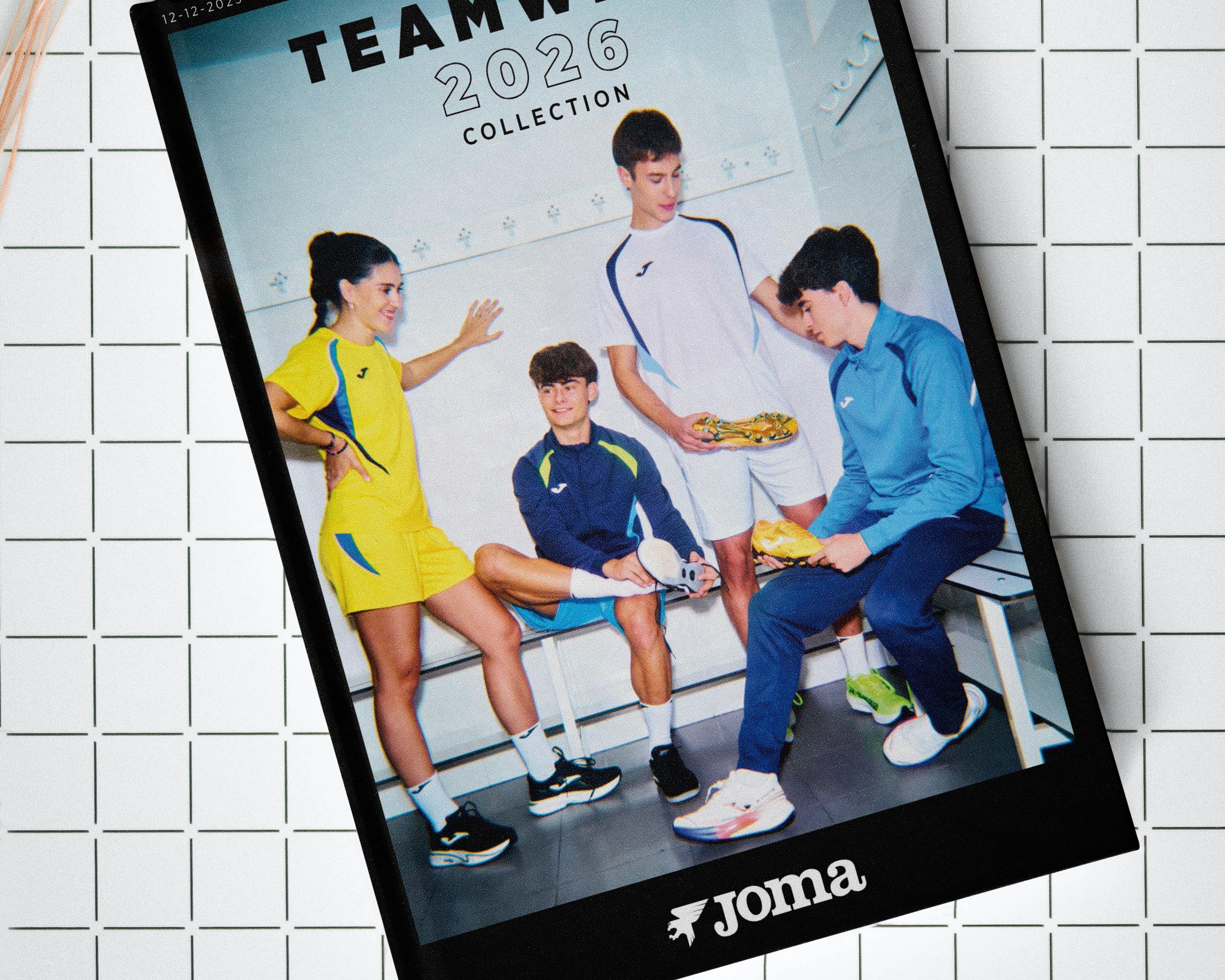 Joma teamwear 2026 collection book on a tiled surface